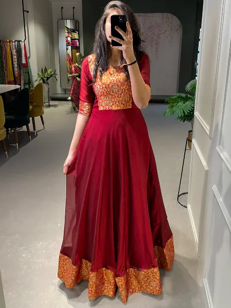 Maroon Color Rangoli Silk Party Wear Gown With Zari Weaving Work